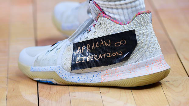 View of Kyrie Irving's white shoes.